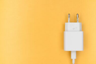 Phone charger on an orange background